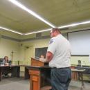 Michael Pieretti, the Coastal Medical Transportation quality officer, speaks to the Select Board while Fire Department Chief Owen Thompson looks on.  Michael Pieretti, the Coastal Medical Transportation quality officer, speaks to the Select Board while Fire Department Chief Owen Thompson looks on.