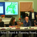 Lloyd Geisinger stands behind the Select Board during his senior housing proposal at the Oct. 14 meeting. 