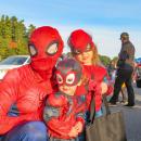 DJ Footit (left) and his two children pose in their coordinating costumes. 