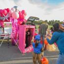A family stops for a photo at the Barbie-themed Jack Conway table. 