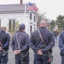 The crowd listens to speakers at the Historic Town Hall in Lakeville.