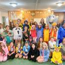 Middleboro Girl Scouts pose together during their Trick or Treat So Others Can Eat event Saturday, Oct. 25.