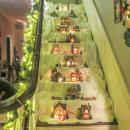 Part of the Christmas village display sits on the house's steps. 