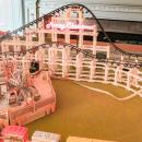 A festive train track wishes visitors a merry Christmas. 