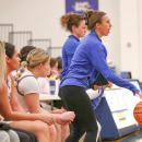 Alexandria Petit, right, coaches from the sideline during an Ursuline College women's basketball game. Photo source: Alexandria Petit