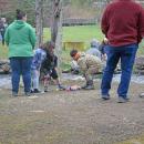 Josephine Runey (7,) Shane Runey (6,) and Caleb Reutzel (6) investigate some of the duckies. 