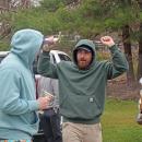 Two racers celebrate with their trophies. 