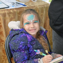 Mari Reis Stavovy shows off her face paint. 