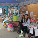Autumn manning a booth.