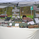Josiah Ponte, age 6, helps man a vender table at the Lakeville plant sale.