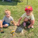 Colton Westgate, 18 months, and Adeline Burns, 5, play on the farm grounds. Photos by Sandy Quadros Bowles 