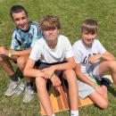 Friends, from left, Andrew Cabral, Nate Wronski and Chase Lynch, all 13, chill out in the sun. 