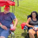 Peter Freitas and Liz Tiago relax on the lawn. 