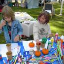 Sisters Lyla, 7, left, and Cheyenne, 9, right, paint pumpkins.