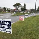 Signs for state representative candidates near Middleboro High School, one of the town's three polling locations. Photo by Christian Uva
