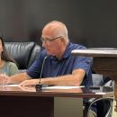 Robert Nunes signs his contract at the Sept. 14 Middleboro Select Board meeting. Photo by Christian Uva