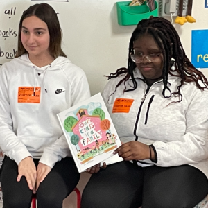 Danica Powers and Juliyah Vilbrun read “Our Class is a Family.’’