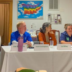 The four speakers sit together as attendees ask questions following their presentations.  The four speakers sit together as attendees ask questions following their presentations.