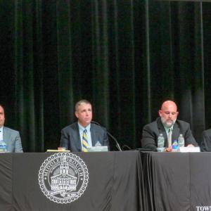 Members of the Select Board and Town Manager James McGrail at the Special Town Meeting. 