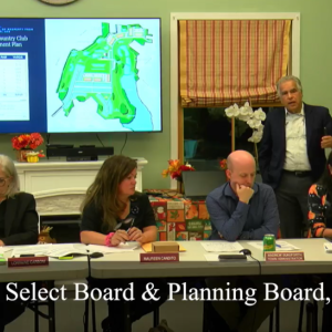Lloyd Geisinger stands behind the Select Board during his senior housing proposal at the Oct. 14 meeting. 