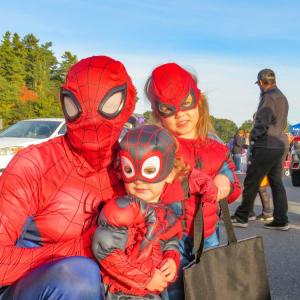 DJ Footit (left) and his two children pose in their coordinating costumes. 