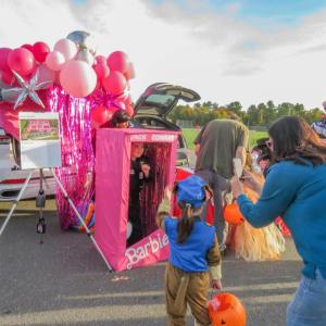 A family stops for a photo at the Barbie-themed Jack Conway table. 