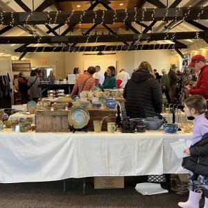 Shoppers browse goods at a past holiday craft fair. Photo source: Lakeville Arts Council