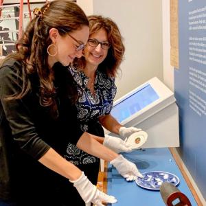 Ariel Hansen, left, and Larissa Hansen-Hallgren work together to assemble a new exhibit for the Lexington History Center in Lexington, Kentucky. Photo source: Larissa Hansen-Hallgren