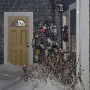 Snow piles up outside a Middleboro house. Photo source: Lorna Brunelle