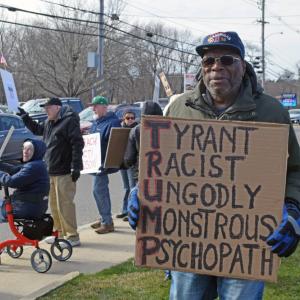 A man shows his 'Trump' acrostic poem.
