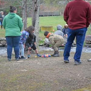 Josephine Runey (7,) Shane Runey (6,) and Caleb Reutzel (6) investigate some of the duckies. 