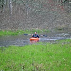 Brenda Velantzas raises her oar in success. 