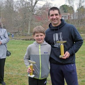 Bill and David Watling hold their trophies. 