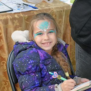 Mari Reis Stavovy shows off her face paint. 