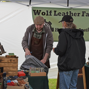 A vendor shows a potential customer his product. 
