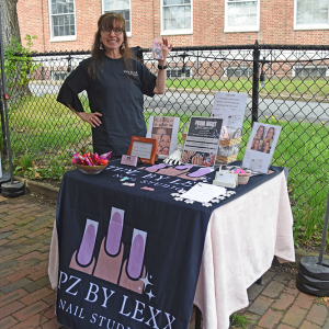 Janet Olivera advertising a new nail salon.