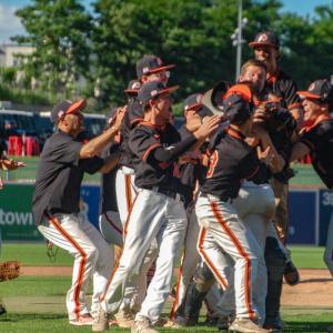 Middleboro players and coaches rush the field as the team clinched a state championship win at Polar Park on Saturday, June 13. Photos by Grace Roche