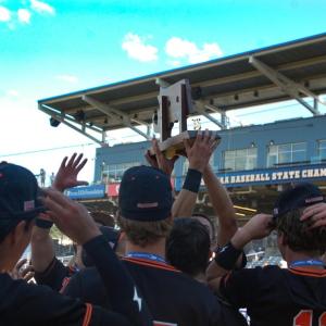 Middleboro players hold up their trophy. 