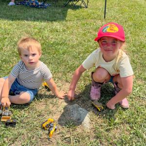 Colton Westgate, 18 months, and Adeline Burns, 5, play on the farm grounds. Photos by Sandy Quadros Bowles 