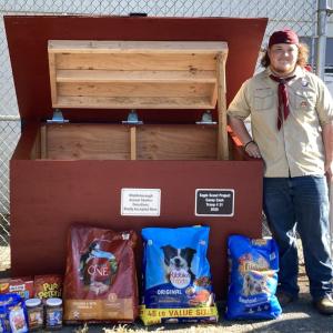 Casey Cash stands beside the new donation bin he built for the Middleboro Animal Shelter. Photo source: Troop 31