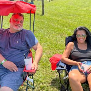 Peter Freitas and Liz Tiago relax on the lawn. 