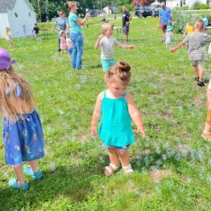 Sophia Lovell, 2, points out some bubbles. Photo by Christian Uva