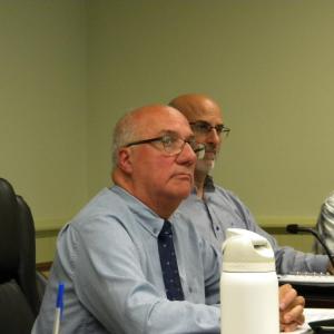 Interim Town Manager Robert Nunes, forward, during his fiscal status update. Photo by Christian Uva