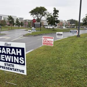 Signs for state representative candidates near Middleboro High School, one of the town's three polling locations. Photo by Christian Uva