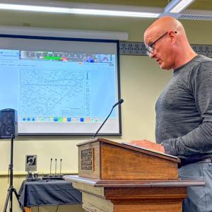 Michael Milanoski, who represents the warehouse project team, speaks at an Oct. 2 Conservation Committee meeting. Photo by Christian Uva