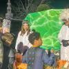 Two trunk-or-treat participants dressed as scientists distribute glow sticks at the event in the Town Hall parking lot Oct. 31. 