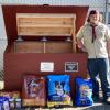 Casey Cash stands beside the new donation bin he built for the Middleboro Animal Shelter. Photo source: Troop 31