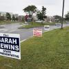 Signs for state representative candidates near Middleboro High School, one of the town's three polling locations. Photo by Christian Uva